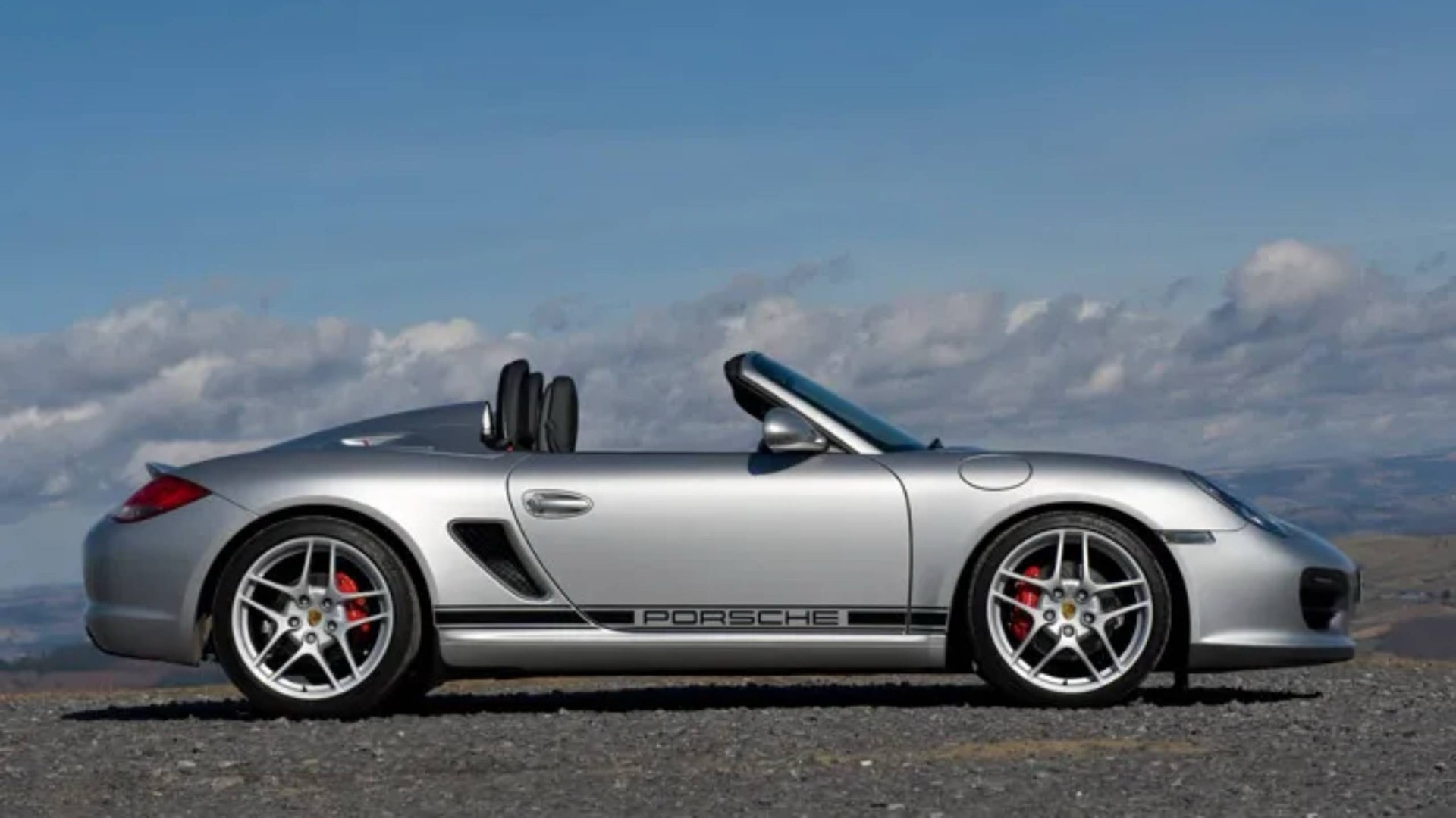 Porsche Boxster silver convertible profile